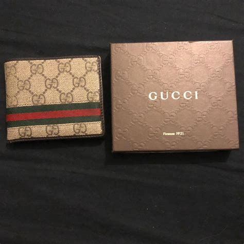 portafoglio uomo gucci marrone con logo nell'angolo|Portafogli GUCCI Uomo .